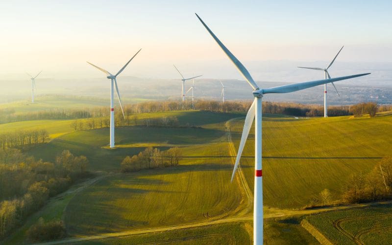 Panoramic view of wind turbine farm in the countryside