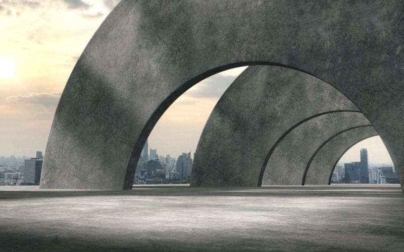Large concrete arches covering a open-plan social walking area