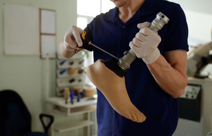 Man assembling a prosthetic leg