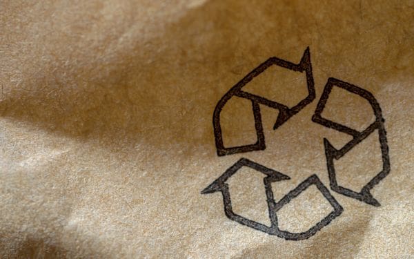 Is adhesive important in recycling corrugated and carton packaging?