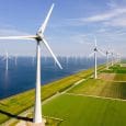 Windmills Turbines And A Blue Sky Generating Electricity Green Energy