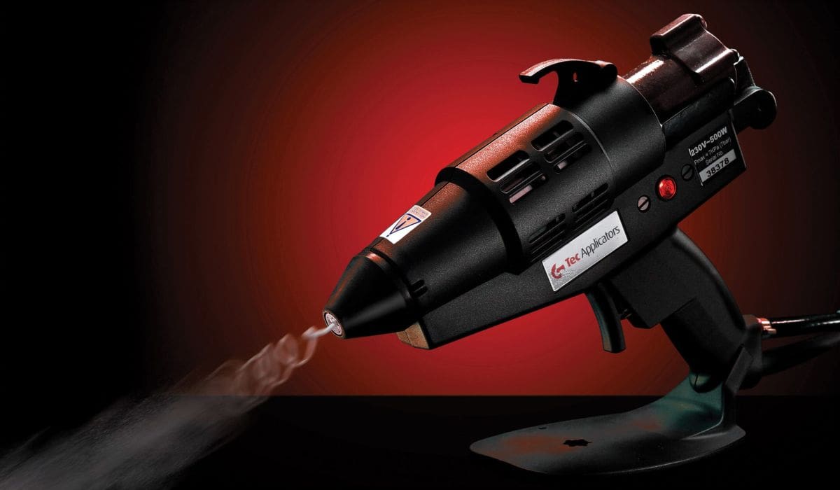 Tec 6300 spray glue gun on a red and black background