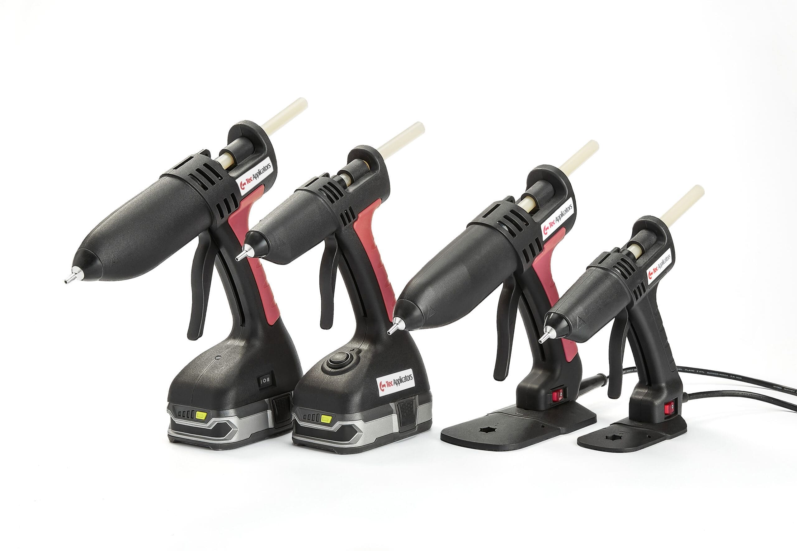 Selection of Tec glue guns on white background