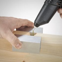Side Knot on a doorframe being filled with Knottec filling compound