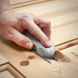 Mouseplane planing tool being used to scrap off excess Knottec compound